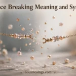 A broken necklace with scattered beads on a soft surface