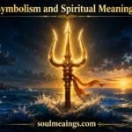 A trident rising from the sea with light surrounding it