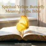 Yellow butterfly on an open Bible with warm light